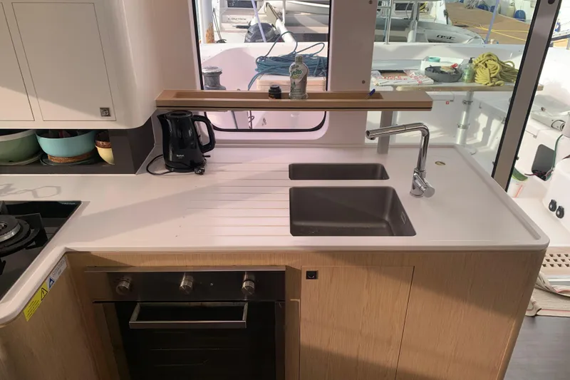 Spekeend Yacht Photos Pics Modern kitchen in 2021 Outremer 51 yacht with dual sinks and appliances.