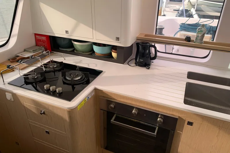 Spekeend Yacht Photos Pics Modern kitchen in 2021 Outremer 51 yacht with stove, oven, and sink.