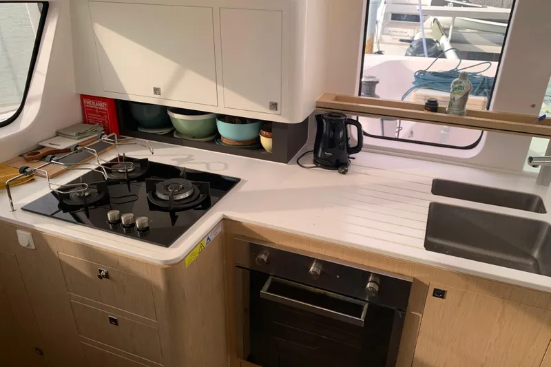 Spekeend Yacht Photos Pics Modern kitchen in 2021 Outremer 51 yacht with stove, oven, and sink.
