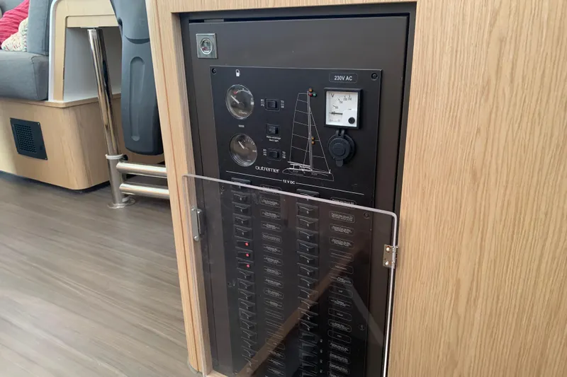 Spekeend Yacht Photos Pics Electrical panel inside 2021 Outremer 51 yacht, featuring switches and gauges.