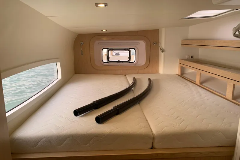 Spekeend Yacht Photos Pics Interior cabin of 2021 Outremer 51 yacht with bed and window view.