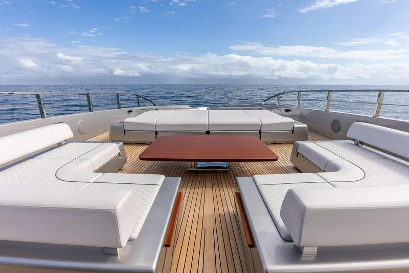 Euro Yacht Photos Pics Luxurious deck of 2024 Riva 130' Bellissima yacht with elegant seating and ocean view.