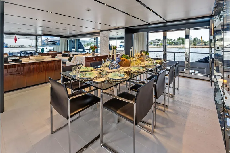 Euro Yacht Photos Pics Luxurious dining area on 2024 Riva 130' Bellissima yacht with elegant table setting.