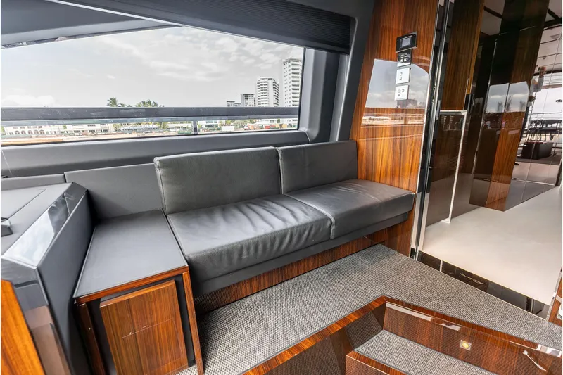 Euro Yacht Photos Pics Luxurious interior of 2024 Riva 130' Bellissima yacht with sleek seating and wood accents.