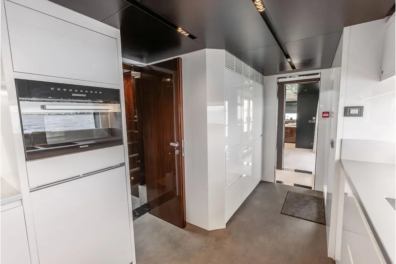 Euro Yacht Photos Pics Luxurious interior of 2024 Riva 130' Bellissima yacht with modern kitchen design.