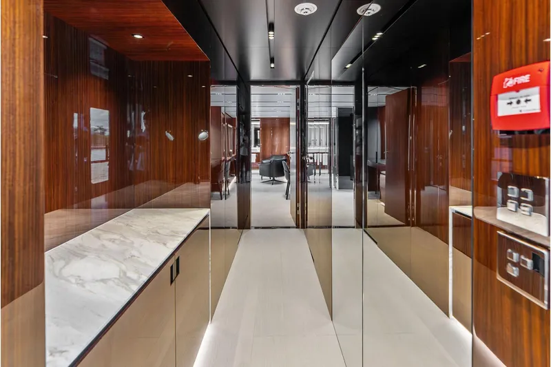 Euro Yacht Photos Pics Luxurious interior of 2024 Riva 130' Bellissima yacht with sleek wood and marble finishes.