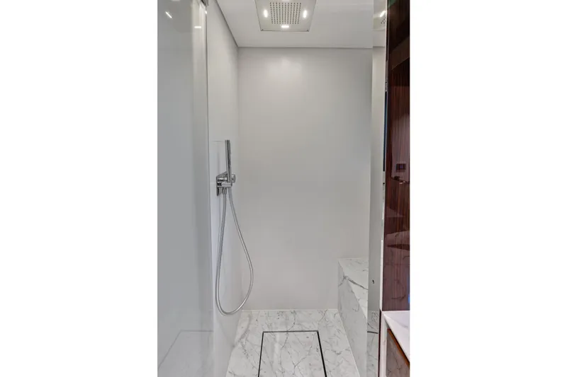 Euro Yacht Photos Pics Luxurious shower area in 2024 Riva 130' Bellissima yacht with marble flooring.
