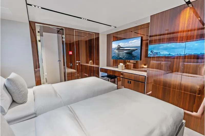 Euro Yacht Photos Pics Luxurious cabin interior of 2024 Riva 130' Bellissima yacht with modern wood finishes.