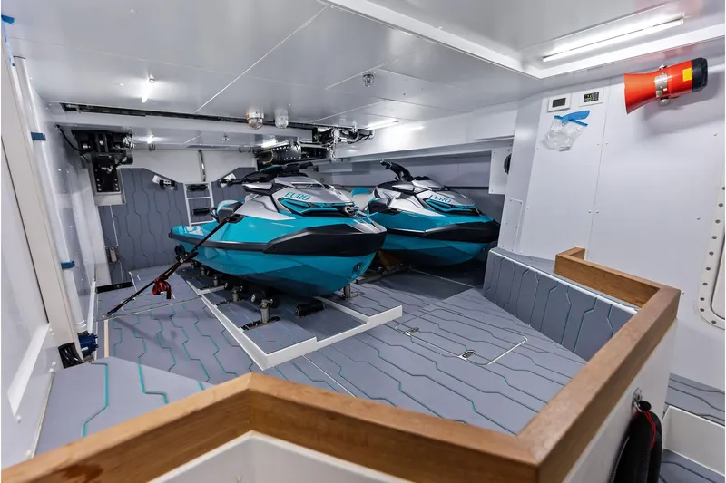 Euro Yacht Photos Pics Interior of 2024 Riva 130' Bellissima yacht with two blue jet skis.