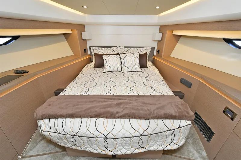  Yacht Photos Pics Luxurious bedroom interior of 2018 Prestige 560 Fly yacht with elegant bedding.
