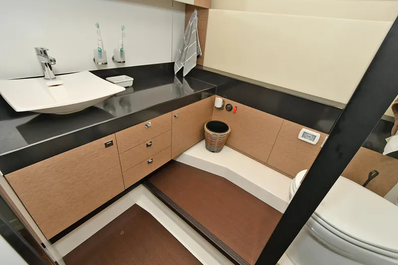  Yacht Photos Pics Luxurious bathroom in 2018 Prestige 560 Fly yacht with modern fixtures and elegant design.