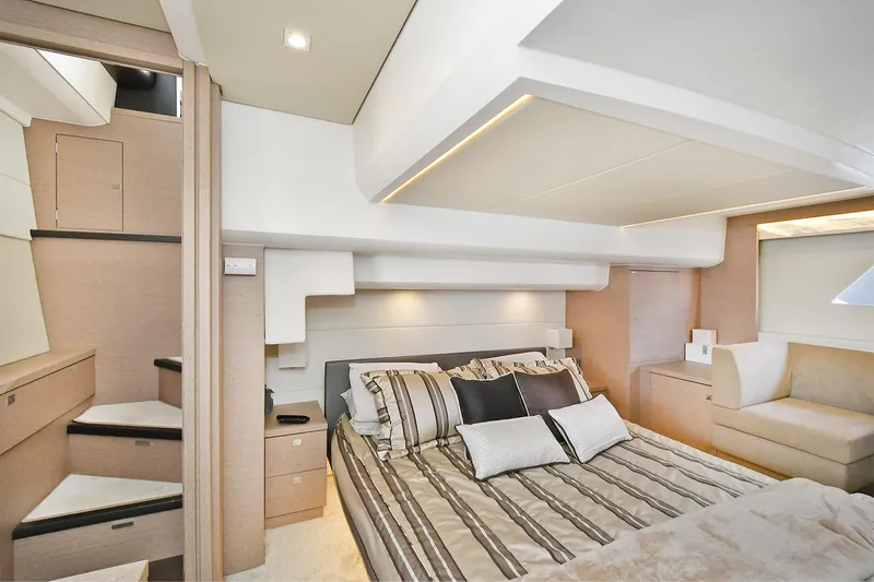  Yacht Photos Pics Luxurious bedroom interior of 2018 Prestige 560 Fly yacht with modern design and cozy bedding.
