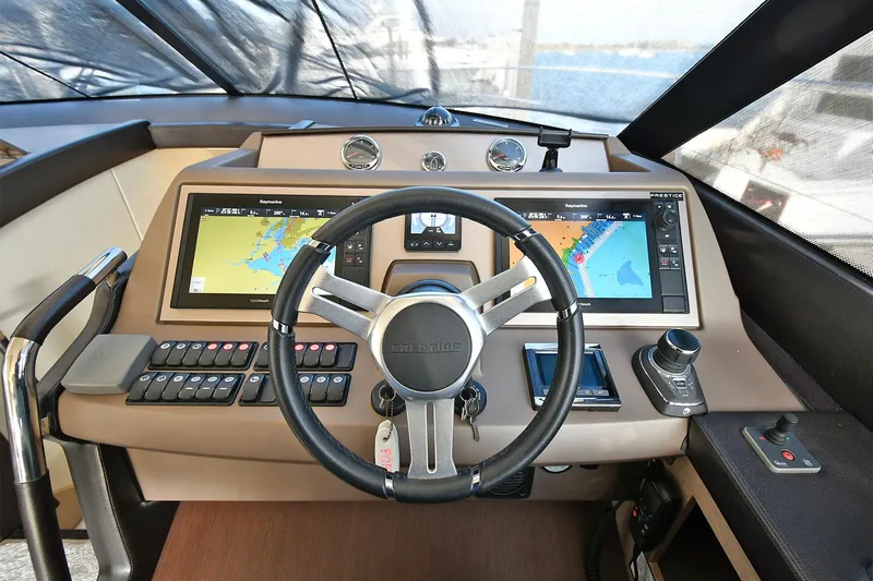  Yacht Photos Pics Cockpit of 2018 Prestige 560 Fly yacht with advanced navigation systems and controls.