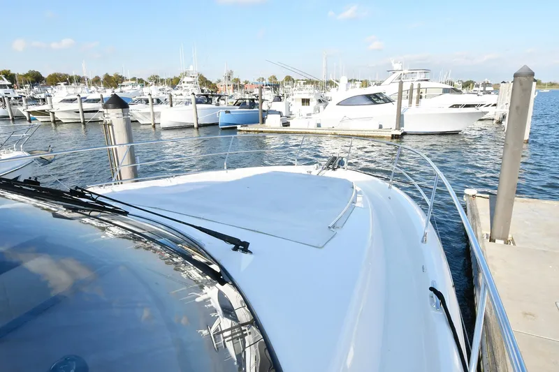  Yacht Photos Pics Prestige 560 Fly 2018 yacht docked at marina with other boats in background.