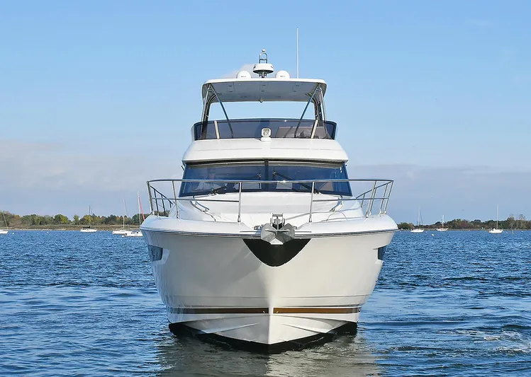  Yacht Photos Pics 2018 Prestige 560 Fly yacht on calm water, front view.