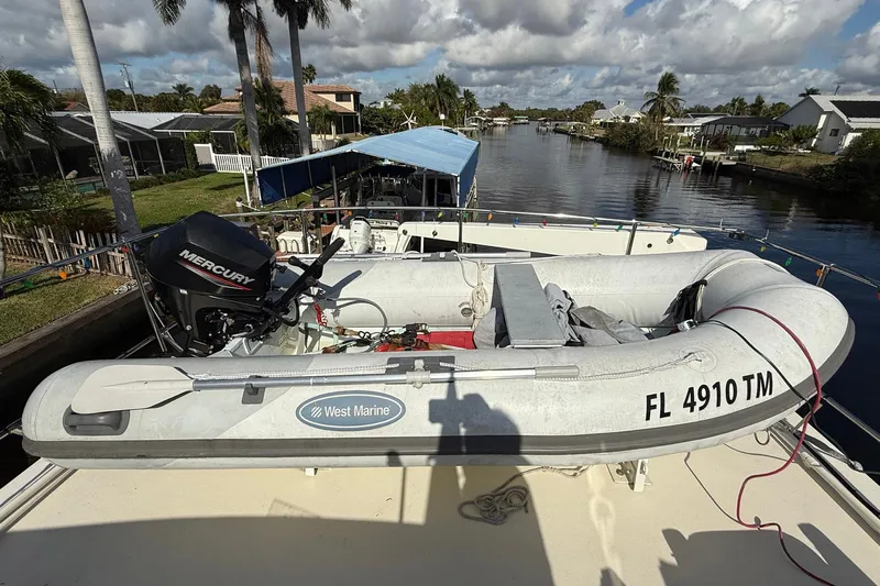 Luv'n Life Yacht Photos Pics Inflatable boat with Mercury motor on 1989 Atlantic 47 Motor Yacht deck.