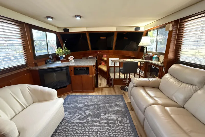 Luv'n Life Yacht Photos Pics Luxurious interior of 1989 Atlantic 47 Motor Yacht with cozy seating and elegant decor.