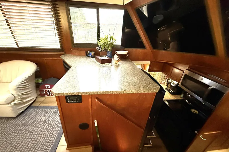 Luv'n Life Yacht Photos Pics Interior of 1989 Atlantic 47 Motor Yacht with modern kitchen and seating area.