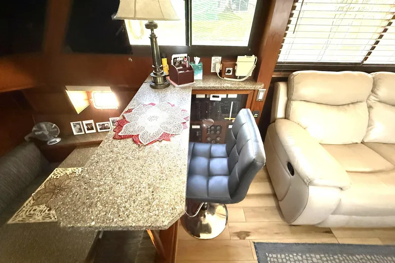 Luv'n Life Yacht Photos Pics Interior of 1989 Atlantic 47 Motor Yacht with seating and control panel.