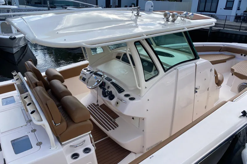  Yacht Photos Pics 2013 Grady-White Canyon 366 boat interior with helm and seating area.