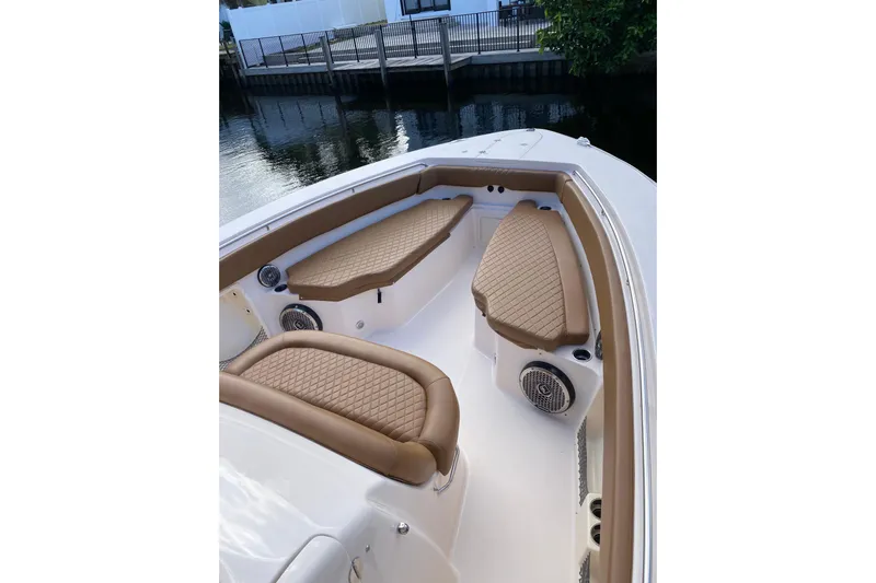  Yacht Photos Pics 2013 Grady-White Canyon 366 boat interior with tan cushioned seating.