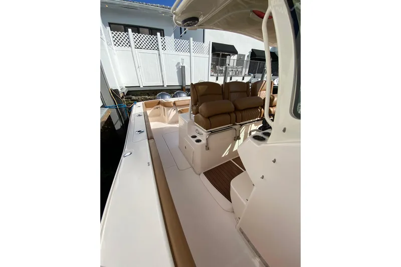  Yacht Photos Pics 2013 Grady-White Canyon 366 boat interior with tan seating and sleek design.