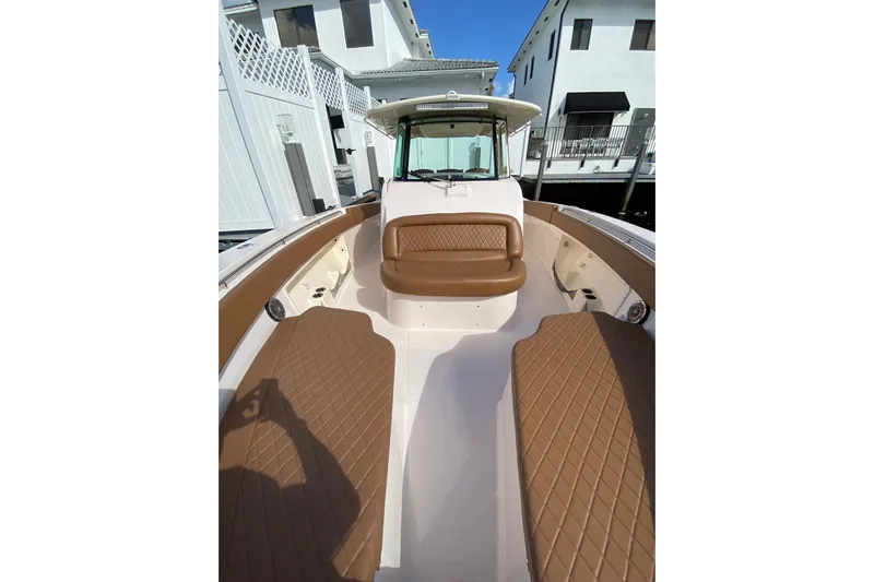  Yacht Photos Pics 2013 Grady-White Canyon 366 boat interior with brown seating and white deck.