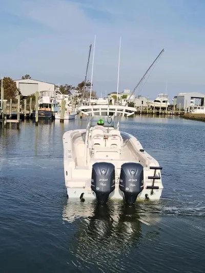 Reel Salty Yacht Photos Pics 2015 Sea Fox 286 Commander boat with twin 250 engines in a marina.