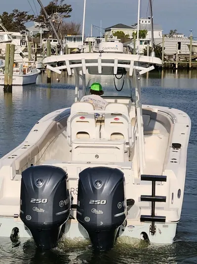 Reel Salty Yacht Photos Pics 2015 Sea Fox 286 Commander boat with twin Yamaha 250 engines in a marina.