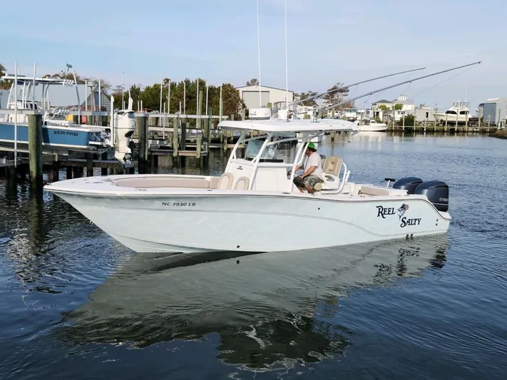 Reel Salty Yacht Photos Pics 2015 Sea Fox 286 Commander boat docked in a marina.