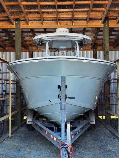 Reel Salty Yacht Photos Pics 2015 Sea Fox 286 Commander boat on a trailer in a covered storage area.