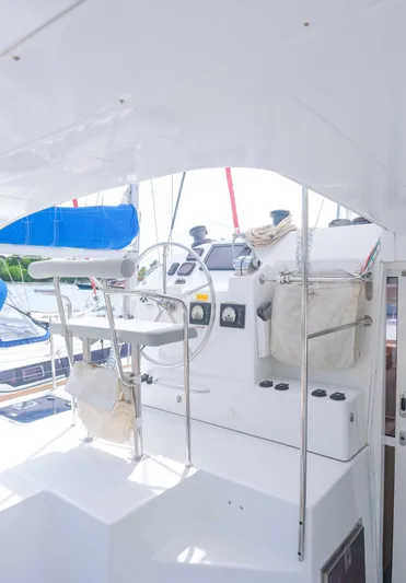 Larimar Yacht Photos Pics 2015 Lagoon 400 S2 yacht helm with steering wheel and navigation controls.