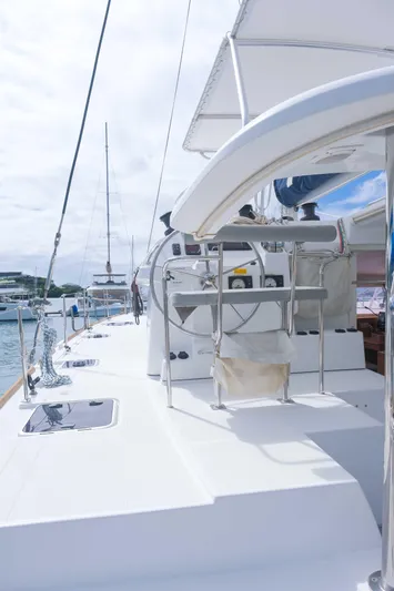 Larimar Yacht Photos Pics 2015 Lagoon 400 S2 catamaran deck with steering wheel and seating area.