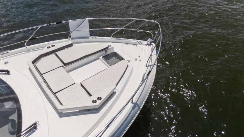 Duke Yacht Photos Pics 2018 Cruisers Yachts 50 Cantius bow with sun pads on water.