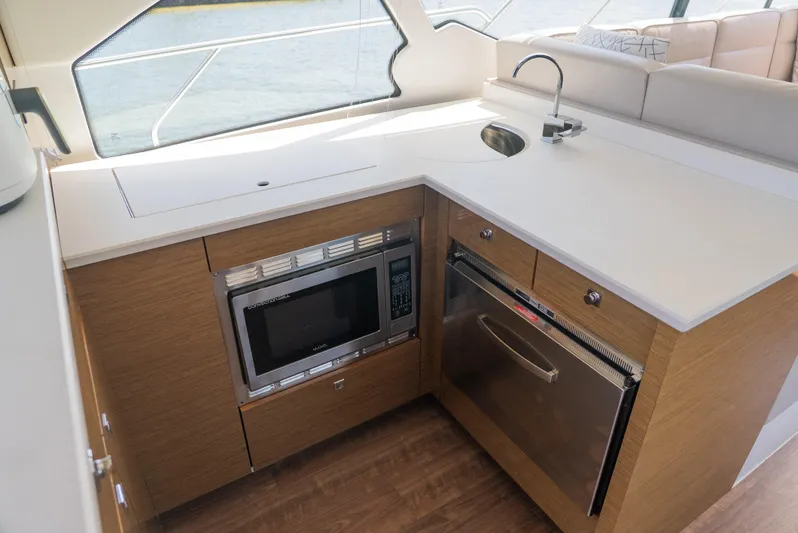 Duke Yacht Photos Pics Modern kitchen area in 2018 Cruisers Yachts 50 Cantius with microwave and sink.