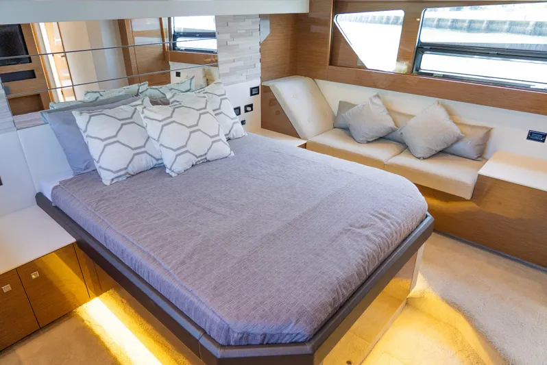 Duke Yacht Photos Pics Luxurious bedroom interior of 2018 Cruisers Yachts 50 Cantius with modern design and cozy bedding.