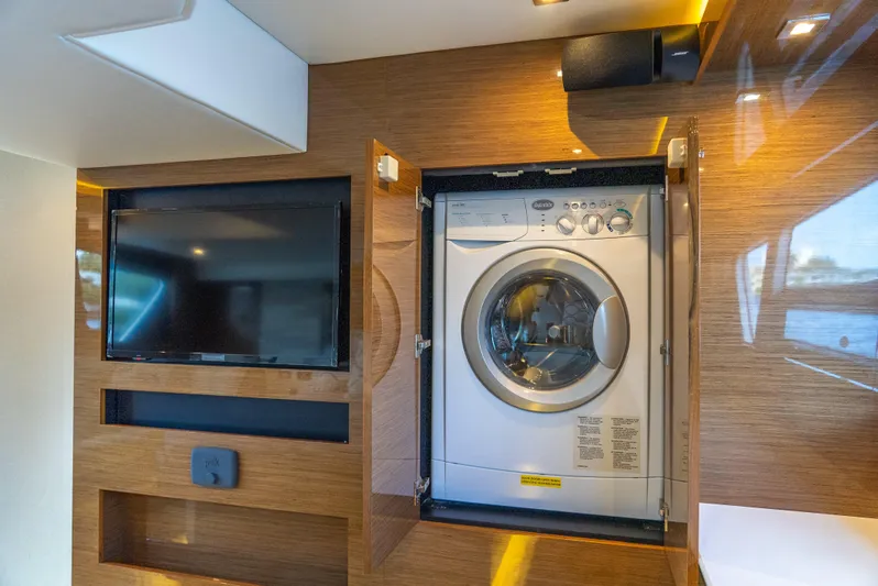 Duke Yacht Photos Pics 2018 Cruisers Yachts 50 Cantius interior with TV and built-in washer.