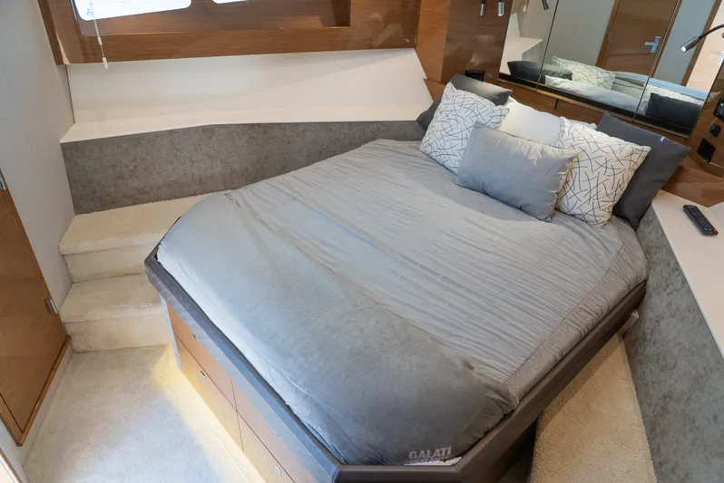 Duke Yacht Photos Pics Luxurious bedroom interior of 2018 Cruisers Yachts 50 Cantius with modern bedding.