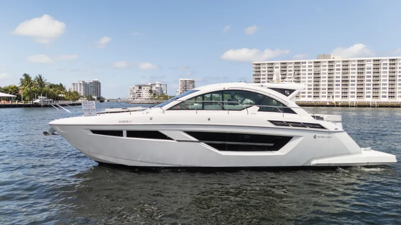 Duke Yacht Photos Pics 2018 Cruisers Yachts 50 Cantius on water, modern design, cityscape background.