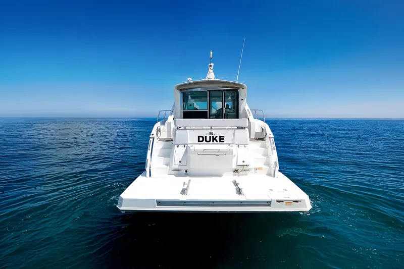 Duke Yacht Photos Pics 2018 Cruisers Yachts 50 Cantius on open sea, rear view.
