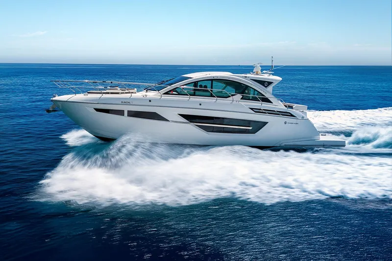 Duke Yacht Photos Pics 2018 Cruisers Yachts 50 Cantius cruising on open blue ocean waters.