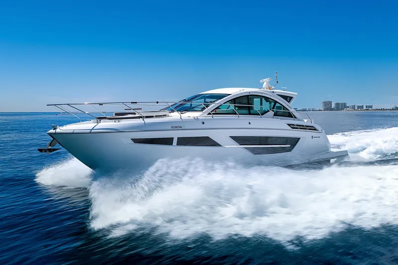 Duke Yacht Photos Pics 2018 Cruisers Yachts 50 Cantius cruising on open water under clear blue skies.