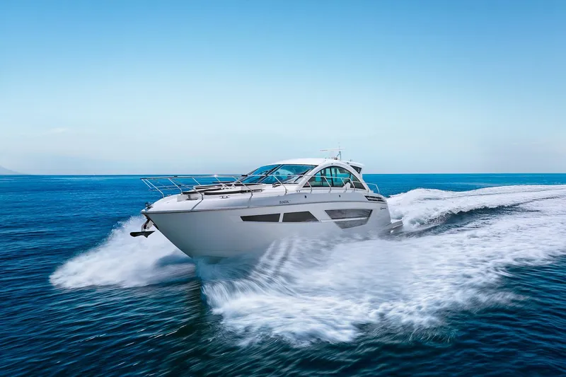 Duke Yacht Photos Pics 2018 Cruisers Yachts 50 Cantius speeding on open blue ocean waters.