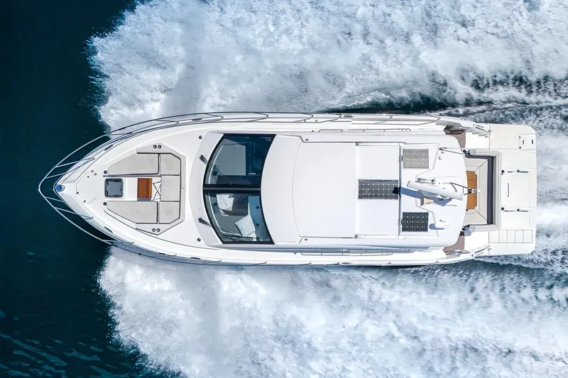Duke Yacht Photos Pics Overhead view of 2018 Cruisers Yachts 50 Cantius cruising on water.