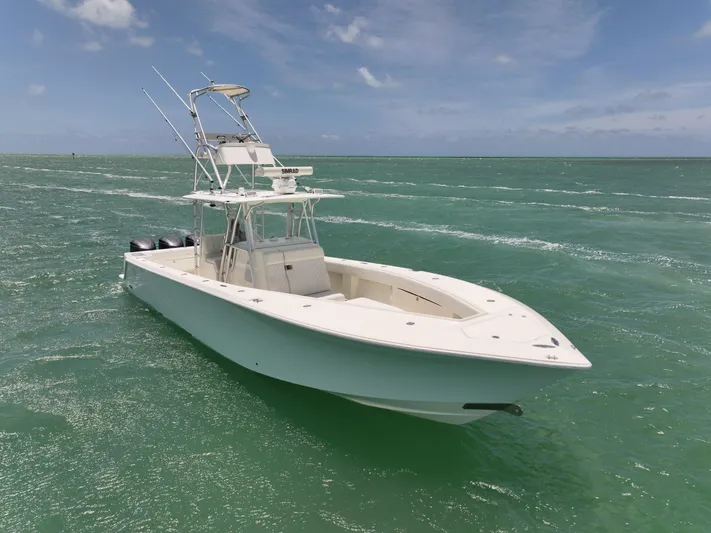  Yacht Photos Pics 2015 SeaVee 370z boat on clear ocean water under a blue sky.