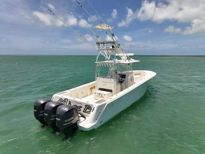  Yacht Photos Pics 2015 SeaVee 370z boat with triple Yamaha engines on open water.