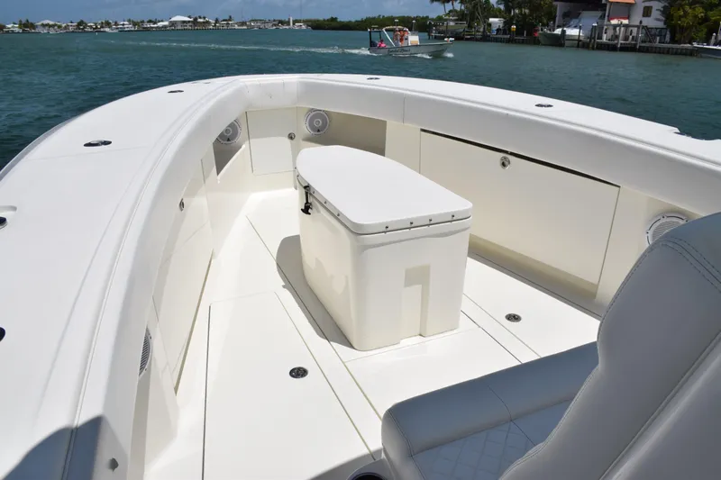  Yacht Photos Pics 2015 SeaVee 370z boat deck with seating and storage, cruising on a sunny day.