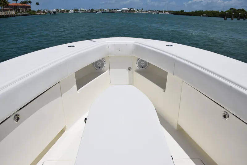  Yacht Photos Pics 2015 SeaVee 370z boat bow with seating and storage compartments on calm water.