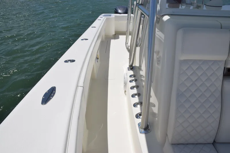  Yacht Photos Pics 2015 SeaVee 370z boat deck with rod holders and cushioned seating.