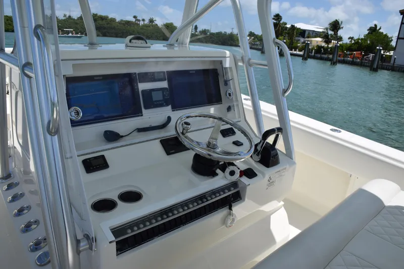  Yacht Photos Pics 2015 SeaVee 370z boat helm with dual screens and steering wheel.